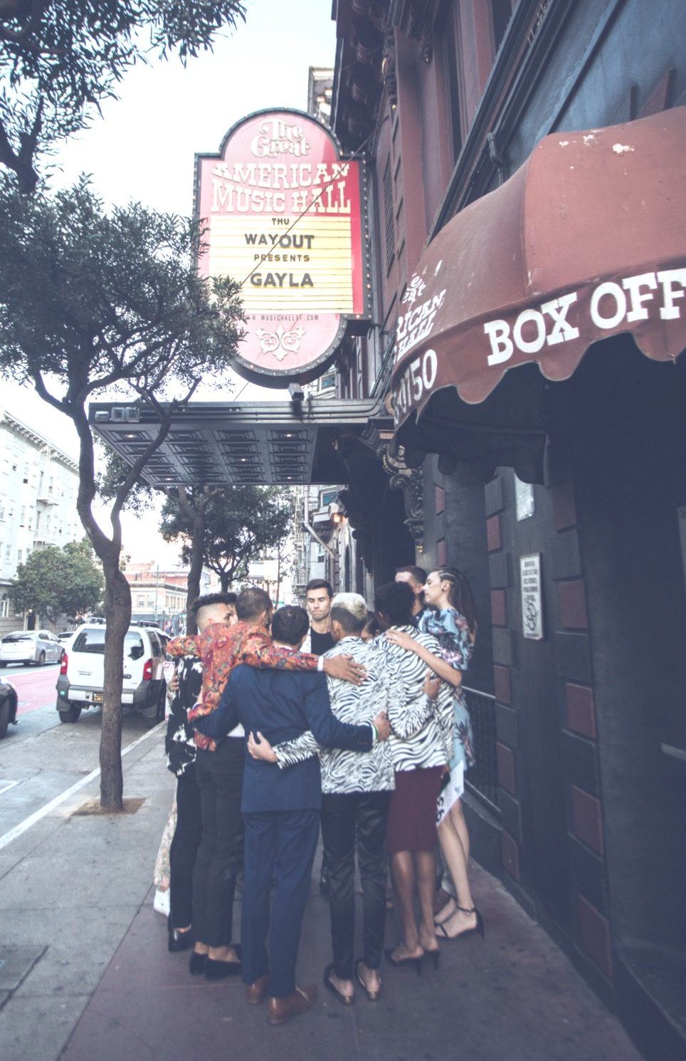 Volunteers hug outside the box office on Gayla night