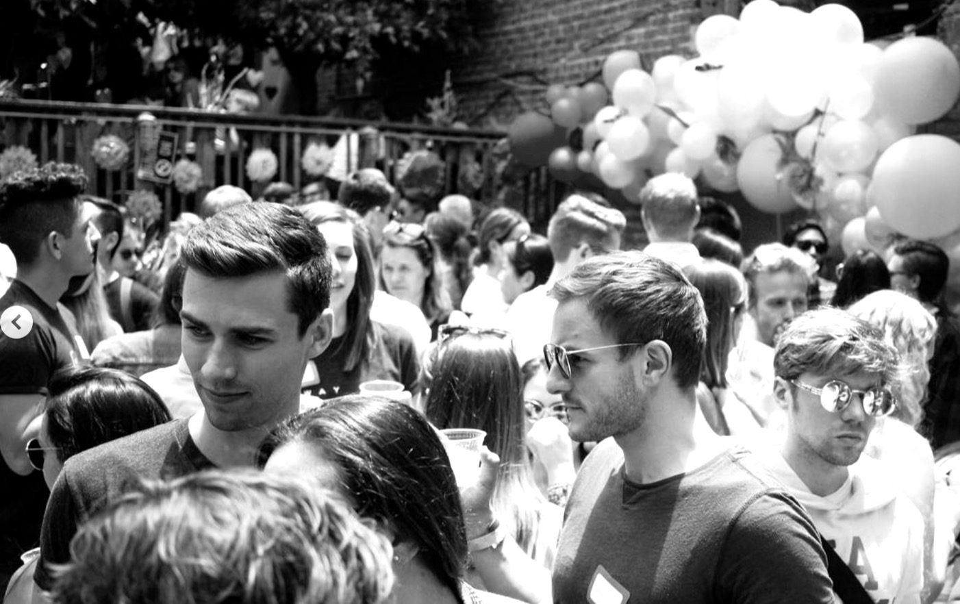 A packed Bay Area crowd in black and white
