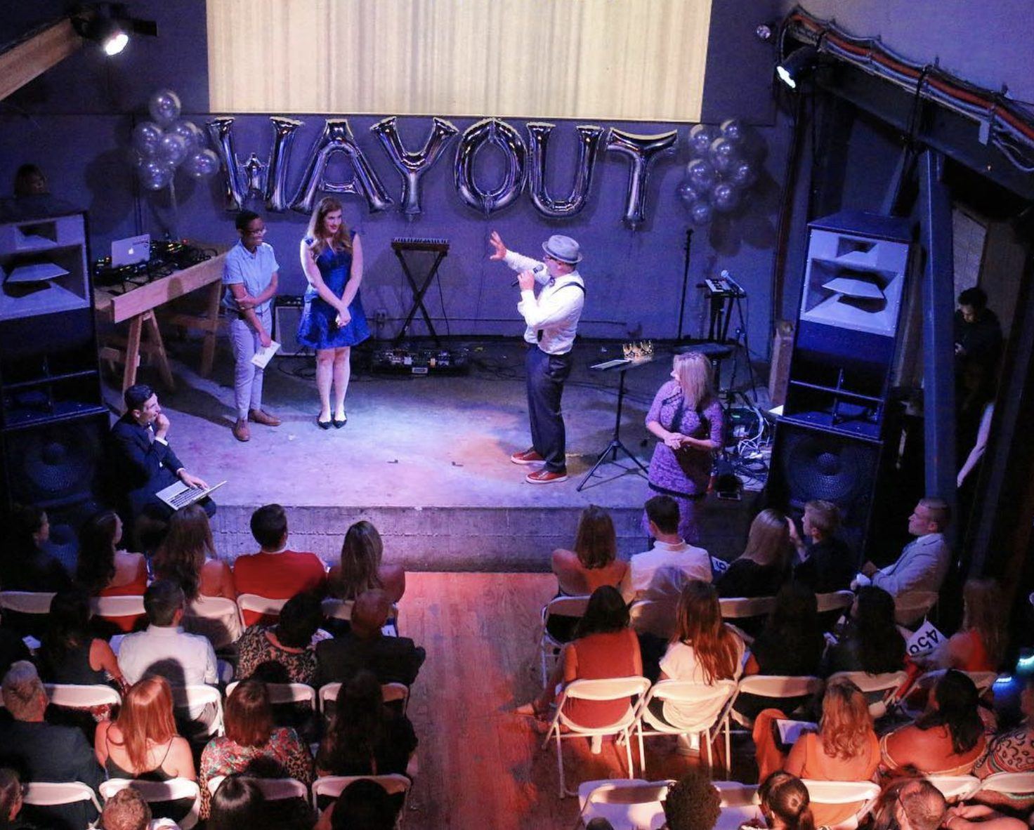 The stage at a Bay Area Gayla, wayOUT balloons overhead