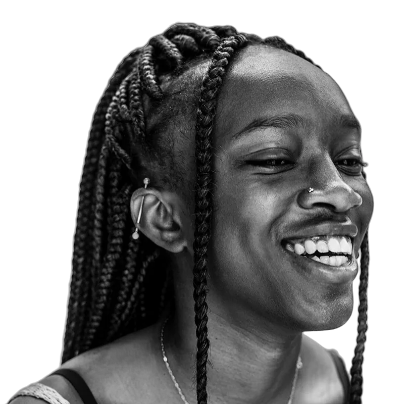 A young person from OUTMemphis with long braids, laughing