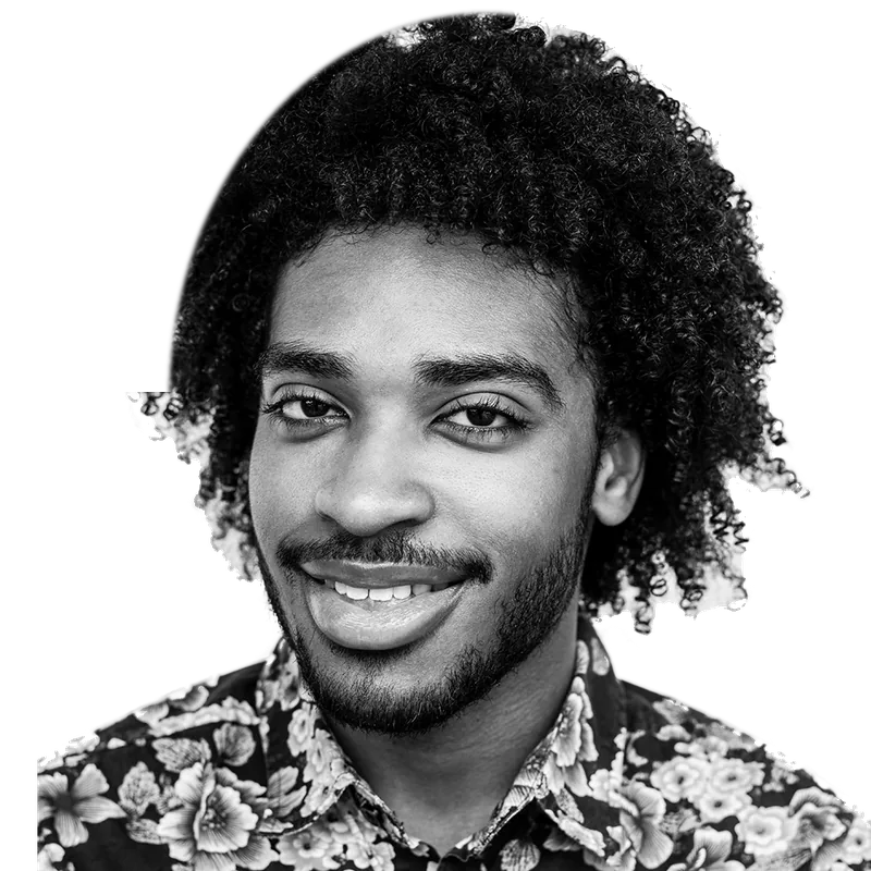 Smiling youth from OUTMemphis with big curly hair